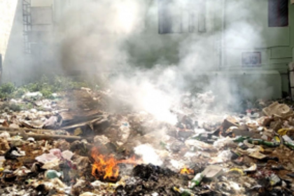 Workers building Western  Bypass forced to burn garbage dumped along stretch