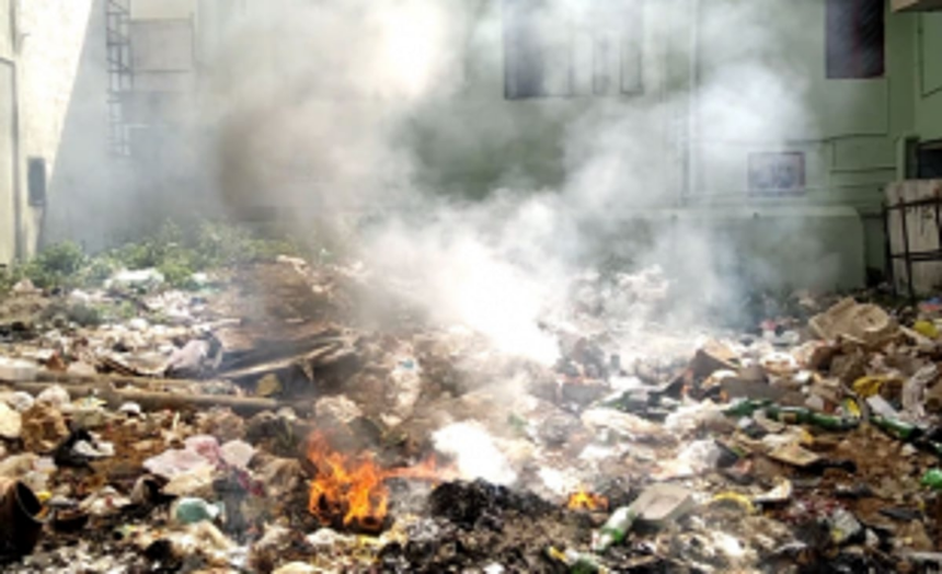 Workers building Western  Bypass forced to burn garbage dumped along stretch