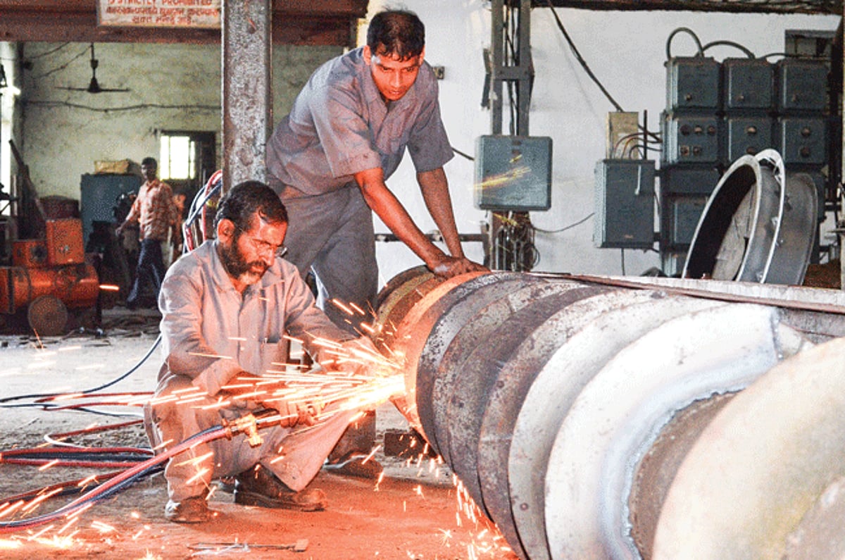 Workers repair machinery at Sanjivani Sahakari Sakhar Karkhana at Dharbandora ahead of the crushing season, which is expected to start from November 20.