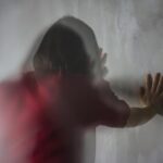 rear view woman standing against wall 1048944 28886198