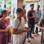 Voters stand in que to vote in the 2026 West Bengal Assembly election