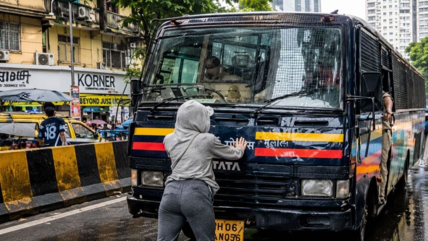 Mumbai Woman Blocking Police Van During NEET Protest Goes Viral 1 Mumbai girl stopping van