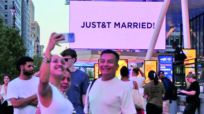 Taylor Swift and Travis Kelce are officially married 3 Swifties clicking selfie with the billboard in background