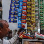 a vendor selling tobacco related items and pan masala waits for the customers in the old quarters of 111223811 16x9 0 1