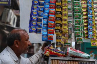 a vendor selling tobacco related items and pan masala waits for the customers in the old quarters of 111223811 16x9 0 1