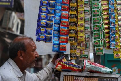 a vendor selling tobacco related items and pan masala waits for the customers in the old quarters of 111223811 16x9 0 1