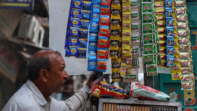 a vendor selling tobacco related items and pan masala waits for the customers in the old quarters of 111223811 16x9 0 1
